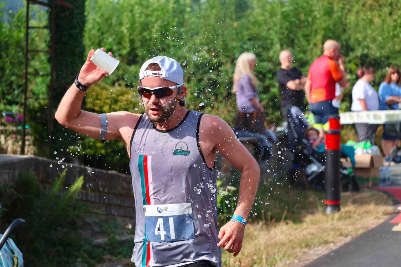 runner pours water on his head