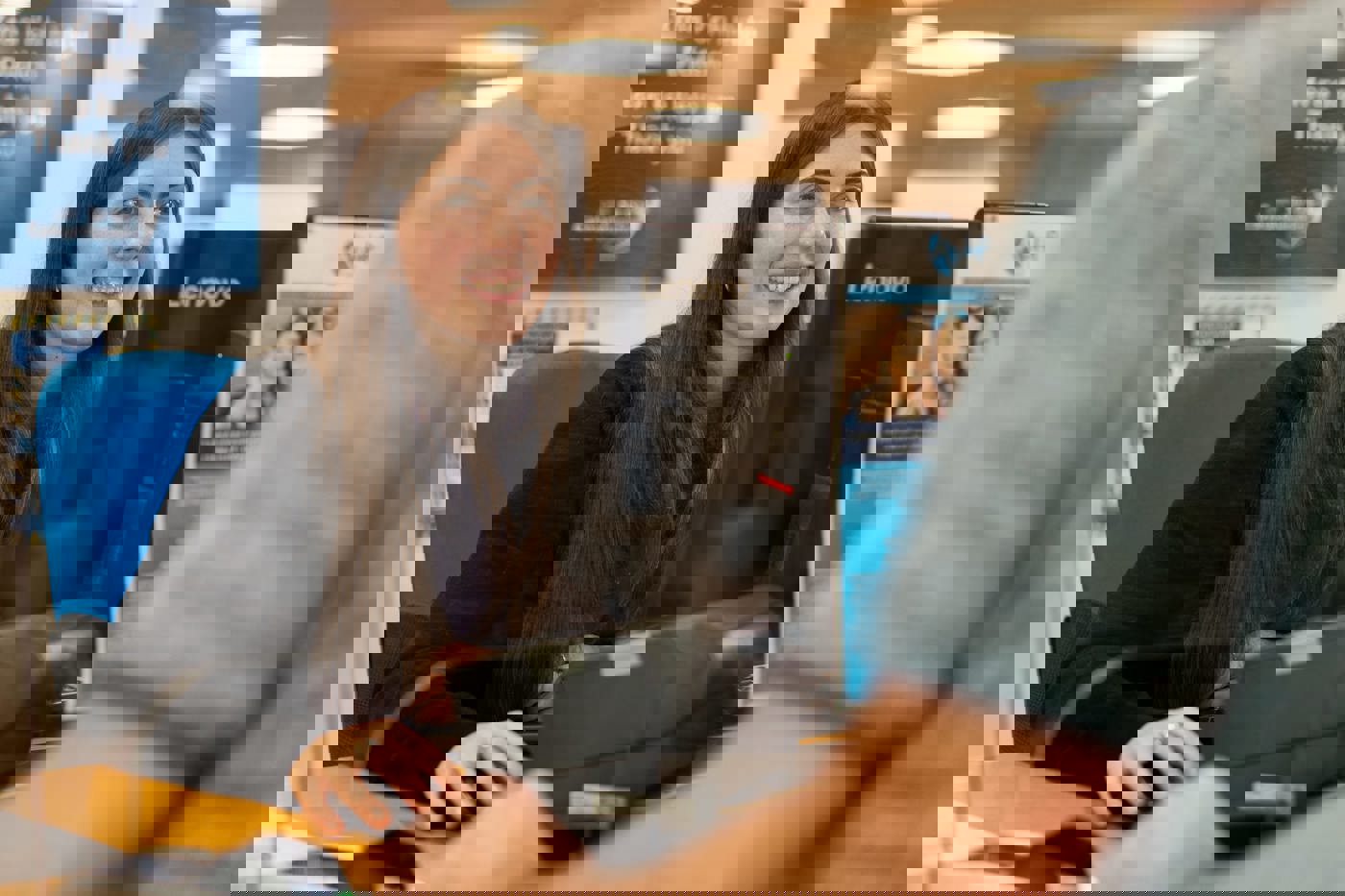 Actif reception staff helping a customer