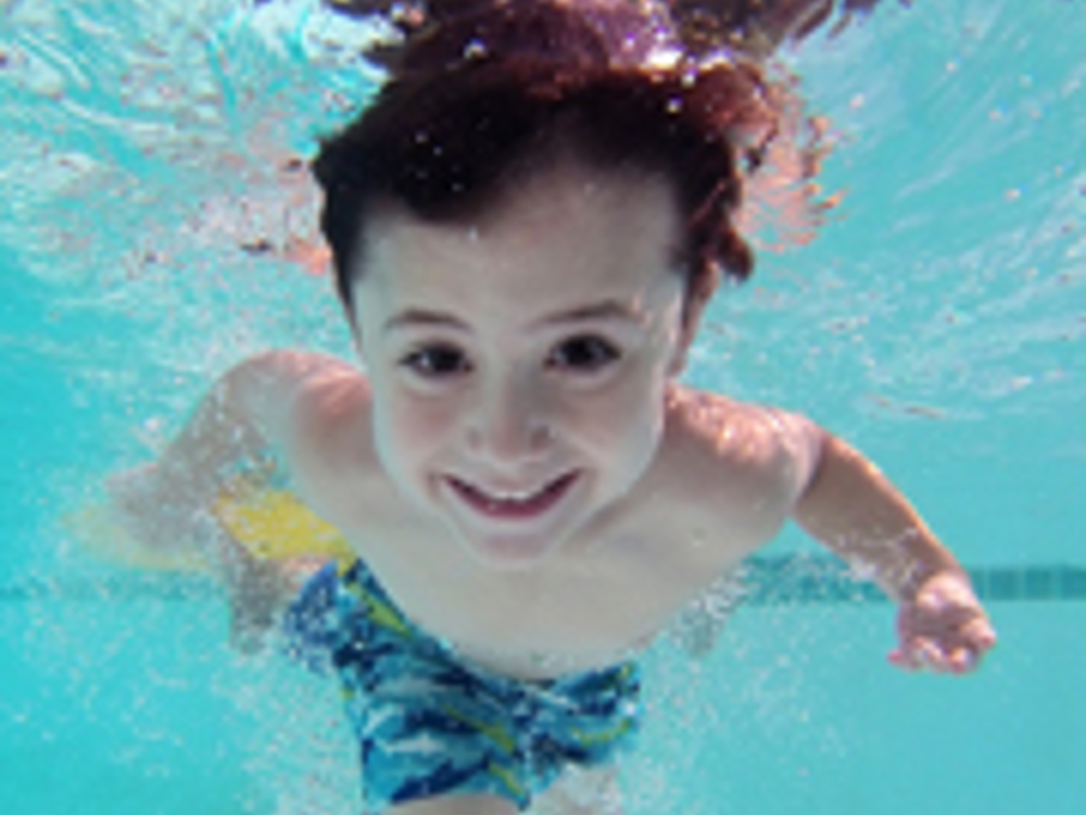 Child underwater swimming